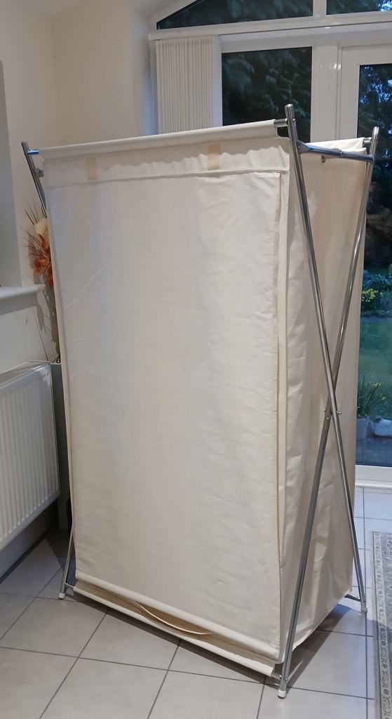Canvas wardrobe with chromed steel tube frame. Simple assembly.