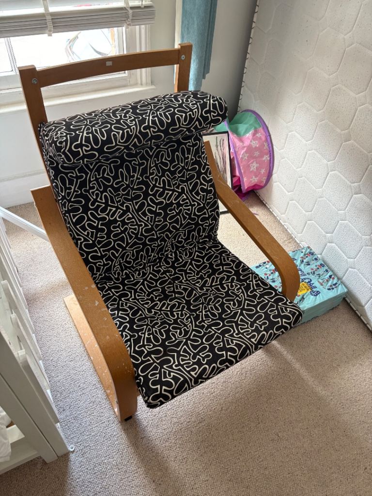 Wooden Rocking Chair with Black Patterned Cushion – Good Condition