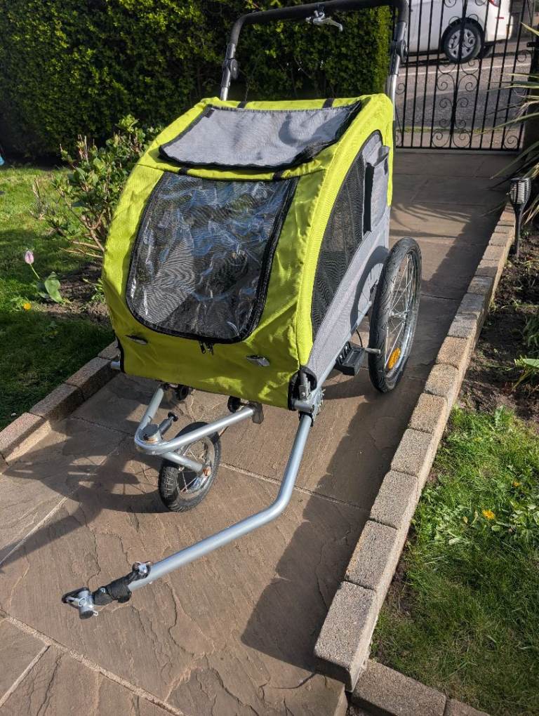Pet stroller with bike attachment 