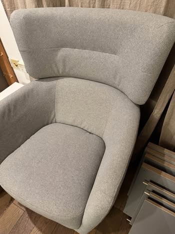 Light grey armchair and footstool  