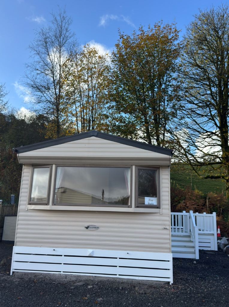 2012 Willerby Rio Gold DG&CH 2 Bed static caravan for sale with plastic decking. Great starter van.