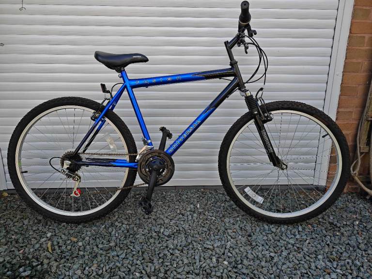 Adults mountain bike hardly used £100 with bike rack carrier