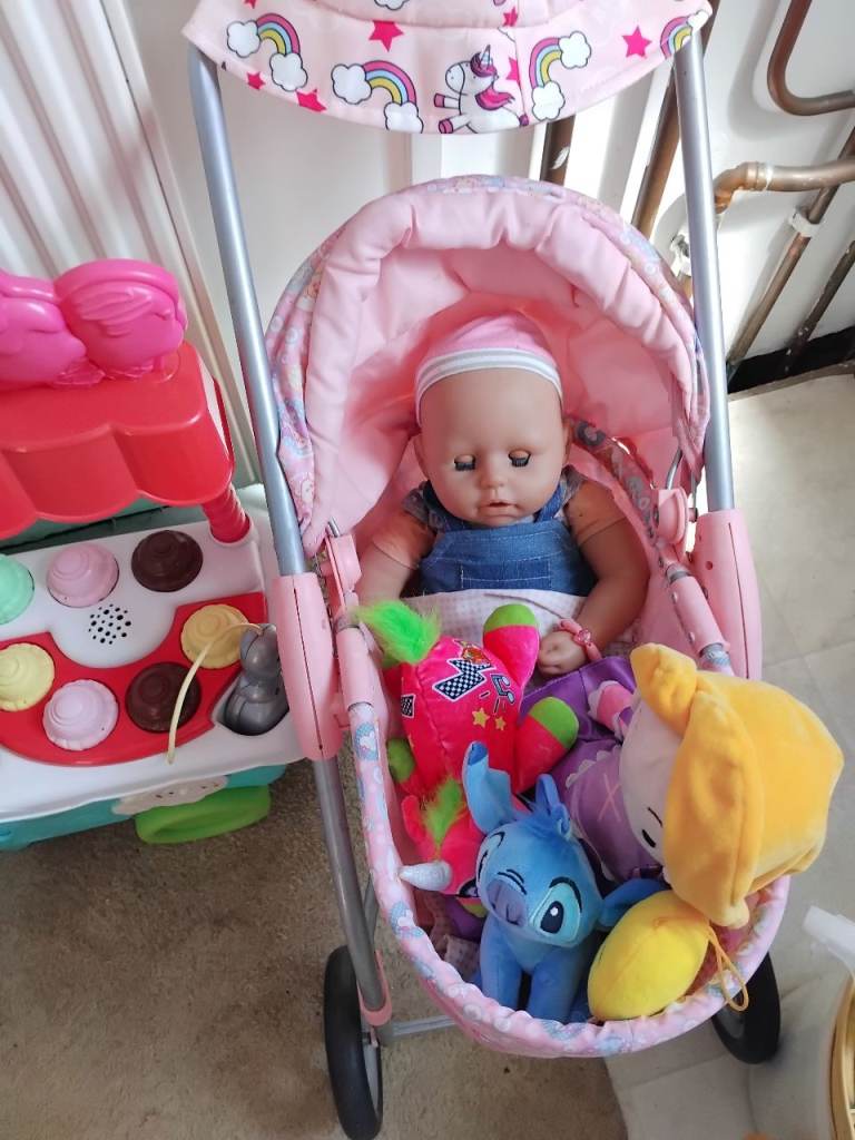 pink dolls pram with dolls also sweet shop,other toys