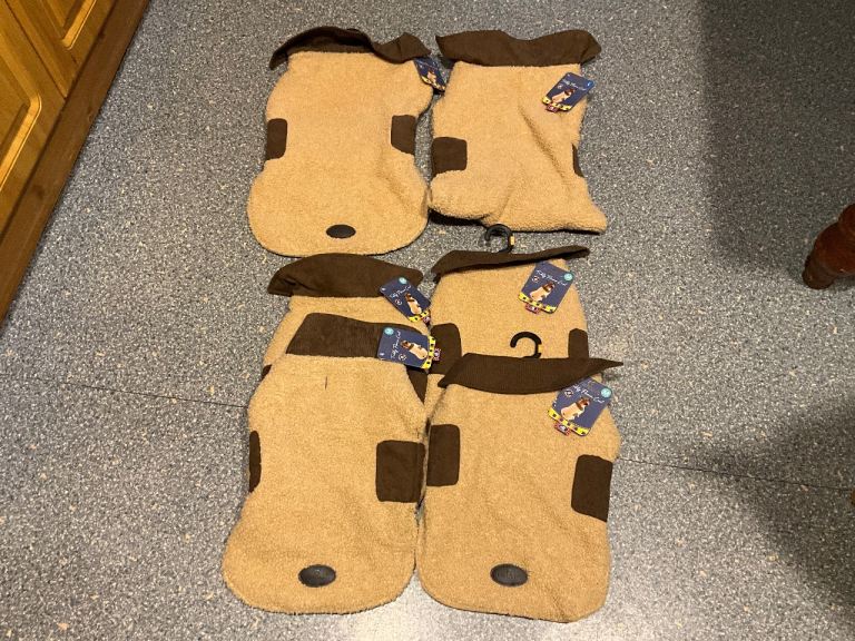 BRAND NEW WITH TAGS, DOG COATS, in sizes medium and large at the moment.