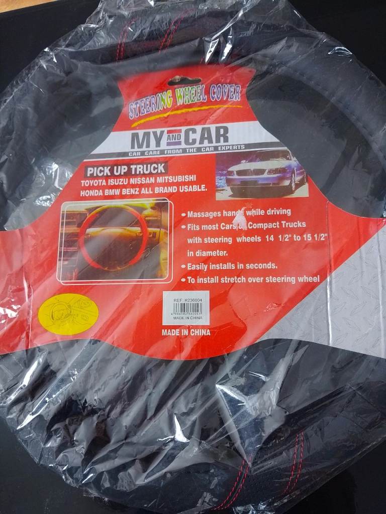 Steering wheel cover, red trim.