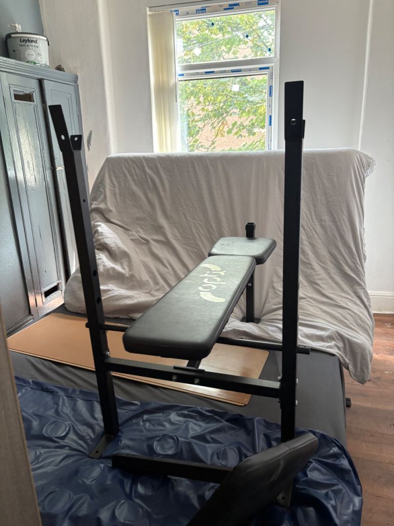 Weight Bench with Barbell and Plates – Good Condition