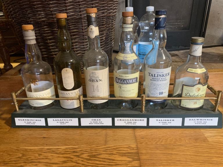 Vintage pub whiskey display with empty bottles