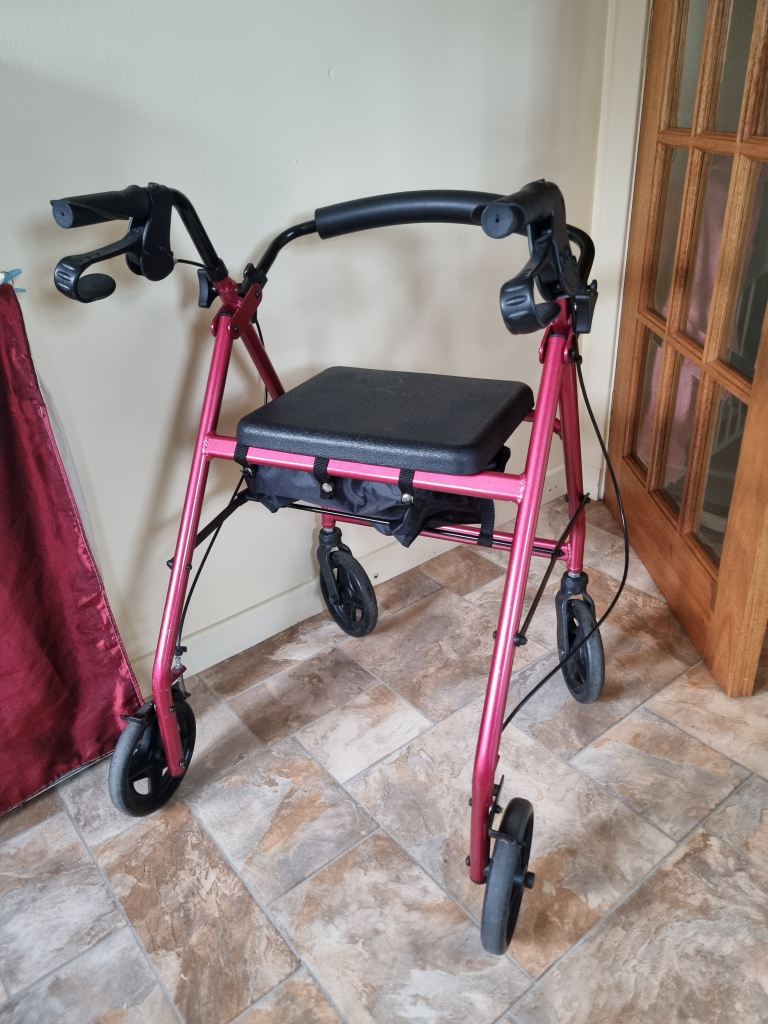 Red Mobility Walker with Seat and Bag – Good Condition