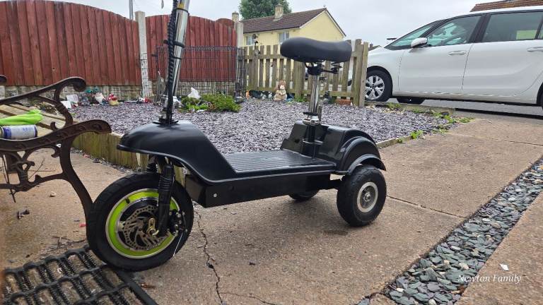 Black Electric Scooter with Seat – Good Condition