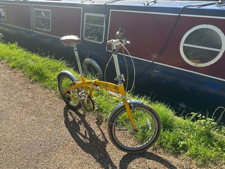 Yellow Bobbin Folding Bike - Good Condition with Cosmetic Wear, Ready to Ride