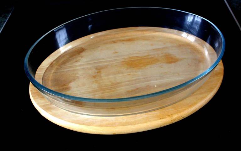 Pyrex Oval Glass Roasting Dish Large with a wooden table plate