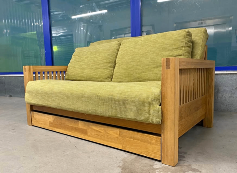 Solid Oak OKE range 2 Seater Futon Company Sofa Bed with under drawer and green armchair 