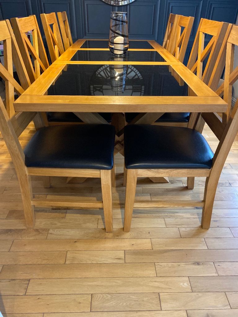Solid oak dining table with black marble inlays  