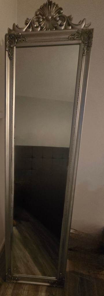 silver full-length floor mirror with a vintage or baroque-inspired design. 