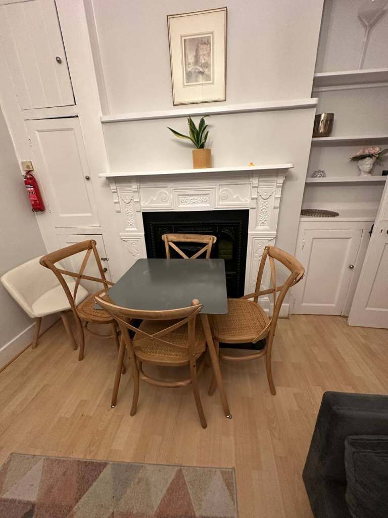 Four Wooden Cross-Back Dining Chairs – Good Condition