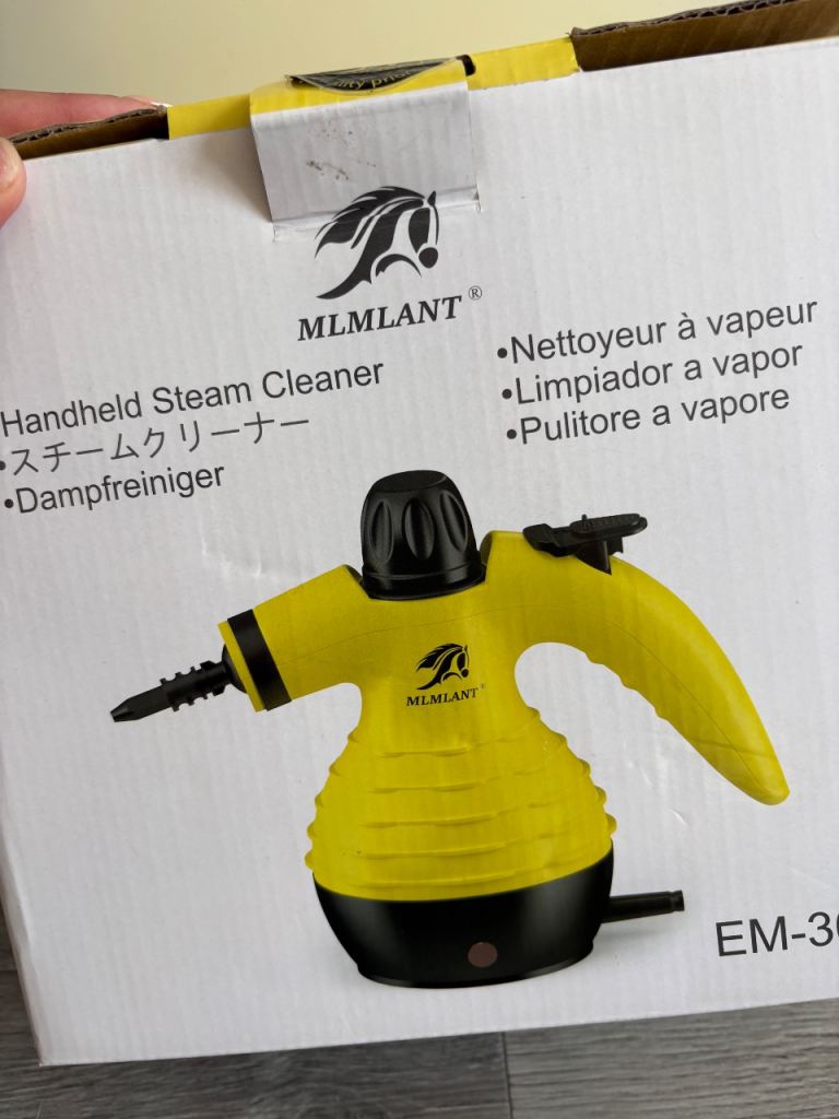 Hand held steam cleaner with attachments 