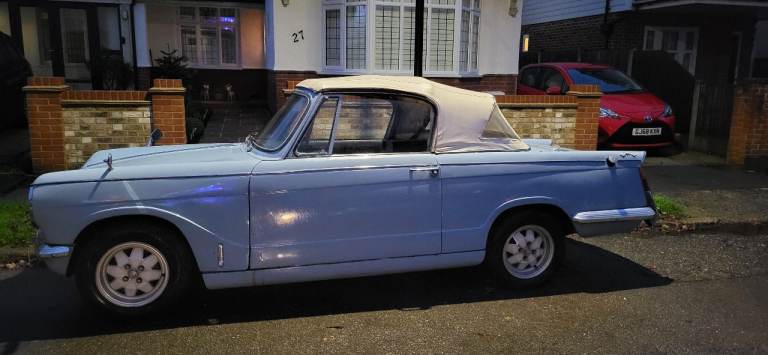 TRIUMPH HERALD GENUINE CONVERTIBLE UNDERNEATH IS EXCELLENT, INSPECTION WELCOME,ON THE ROAD