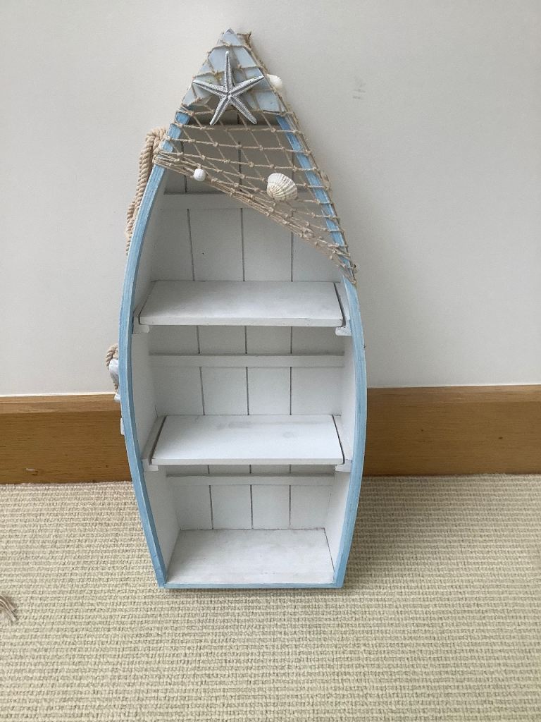 Decorative Display shelves in form of a rowing boat. Beach theme standing shelves 