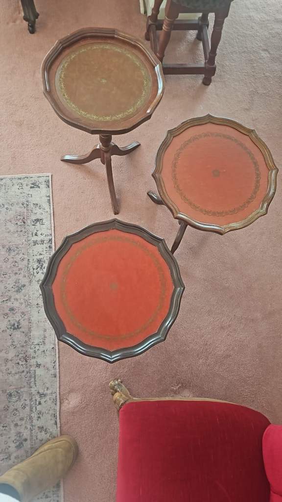 Vintage mahogany leather-topped tripod side tables