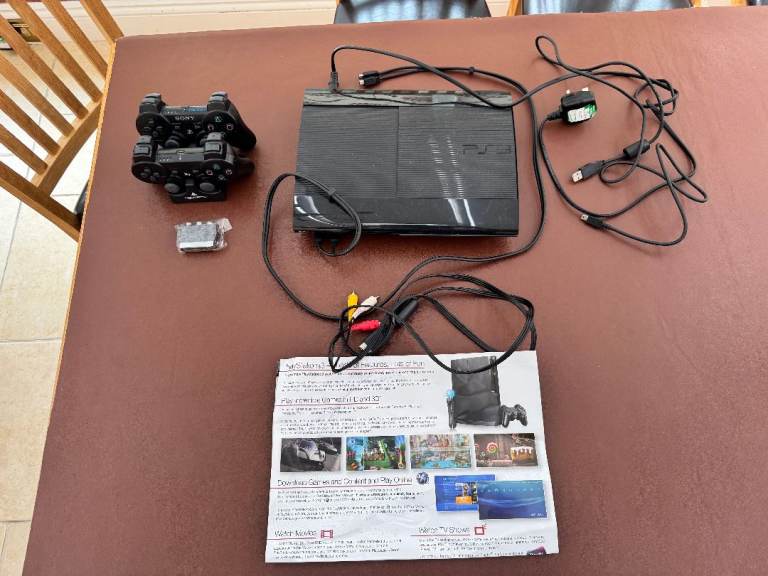 PlayStation 3 console with 2 handsets and cable bundle too