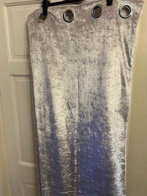 silver coloured eyelet curtains