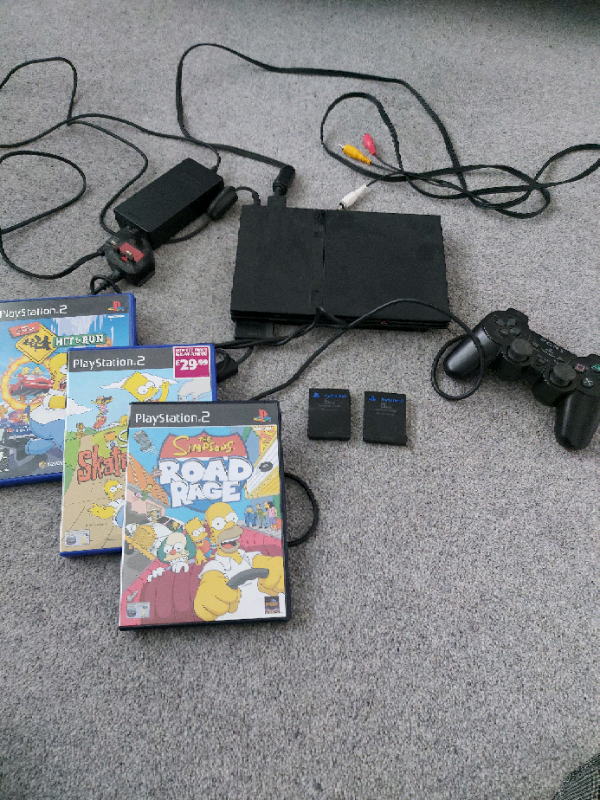 PlayStation 2 + controller and 3 games