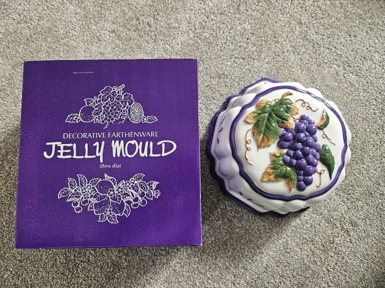 Selling a new decorative ceramic Jelly Mould Grape (8 inches).