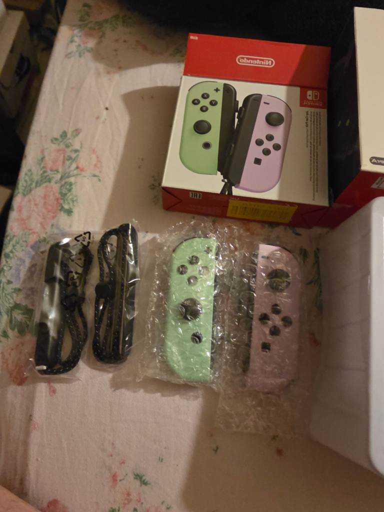 One Brand new set of Joy-Con switch controllers with controller straps 