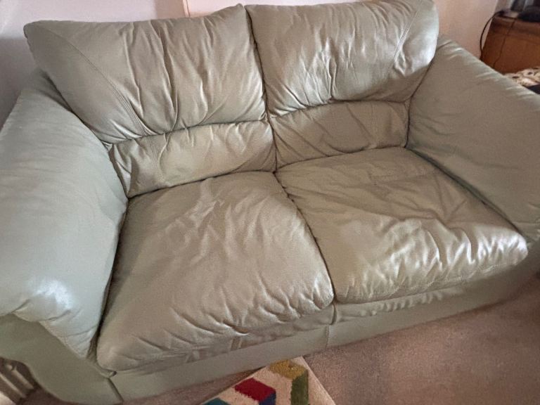 image for Leather 2 seater sofa in mint green. Less than 1 year old 