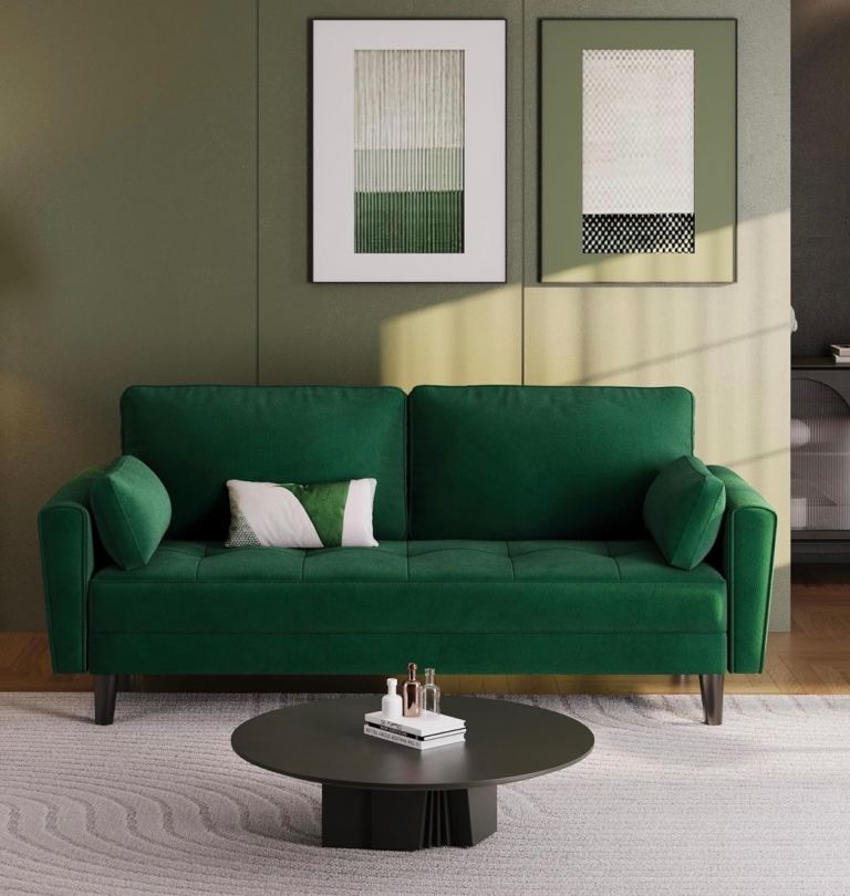 Green velvet 3 seater sofas.