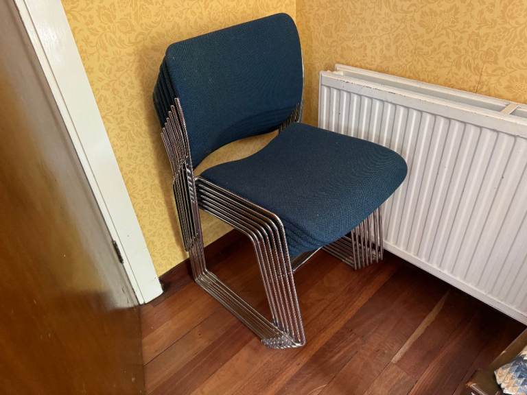 Seven high quality blue stacking chairs - Classic Howe of Europe. 