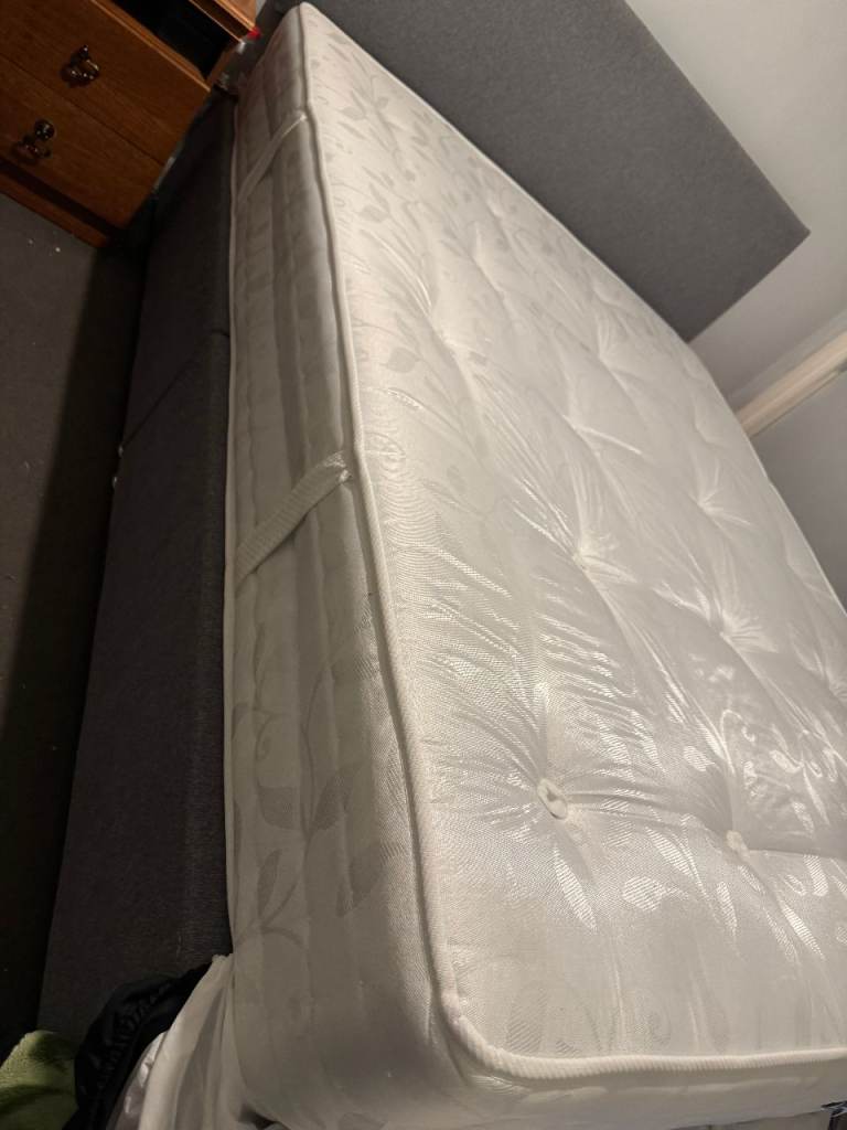 King sized Bed with Mattress, unpacked but new and unused.