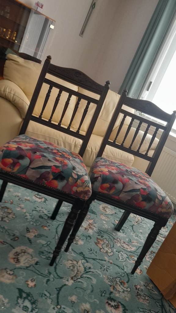 Two Wooden Dining Chairs with Floral Cushions