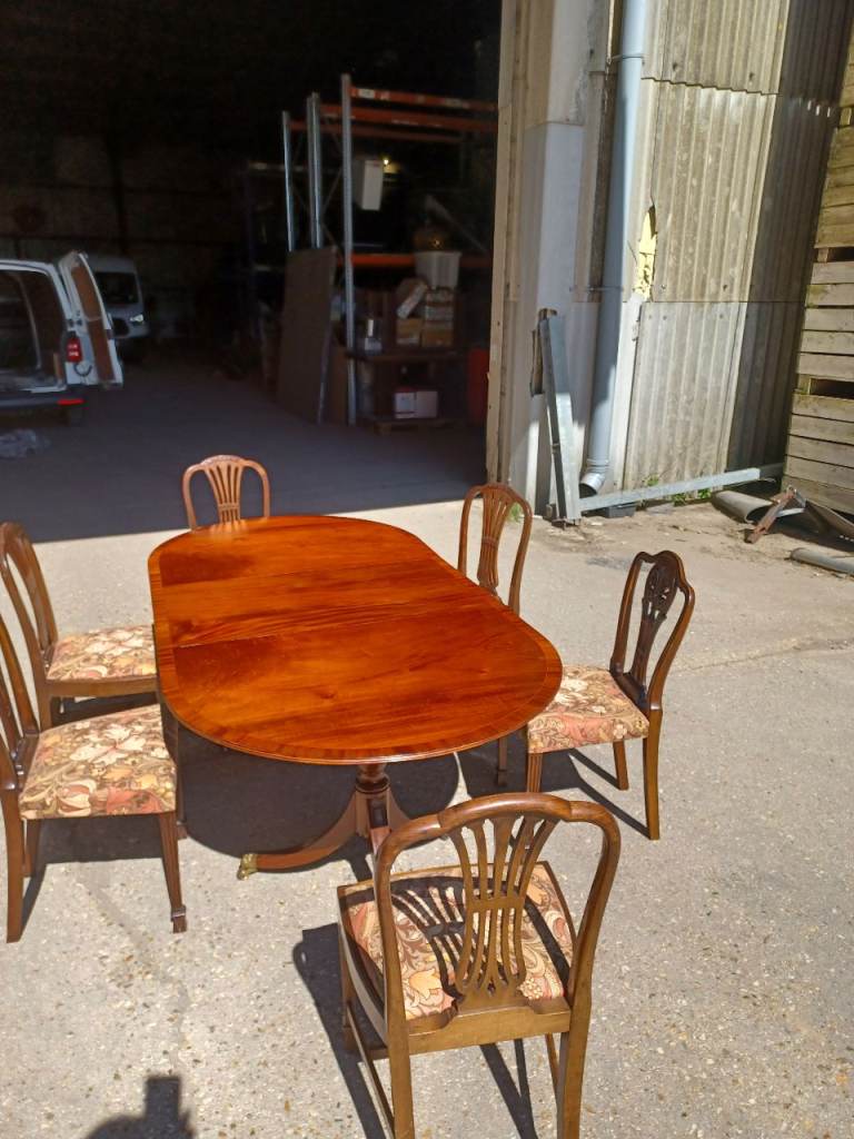 Extending Rosewood table with chairs 