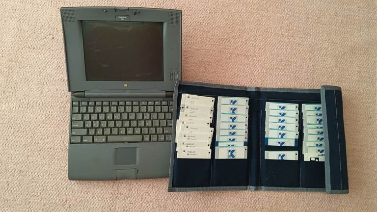 Vintage Grey Apple Laptop with Floppy Disks and Case