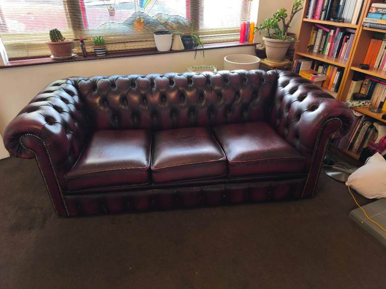 Matching pair of Chesterfield style leather sofas