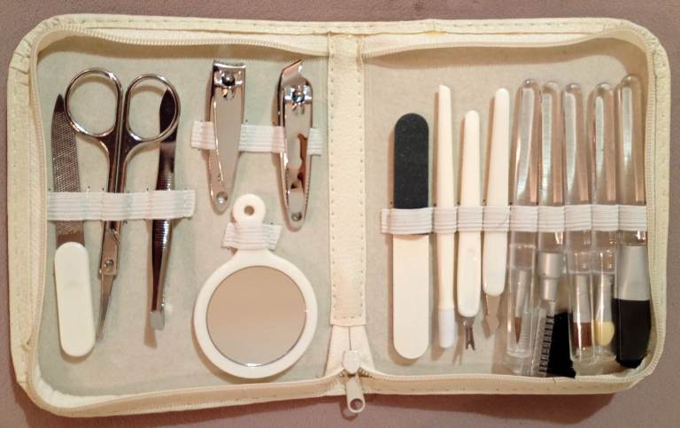White faux leather travel manicure and make up brush set all in one case. Brand New. 15 piece manic