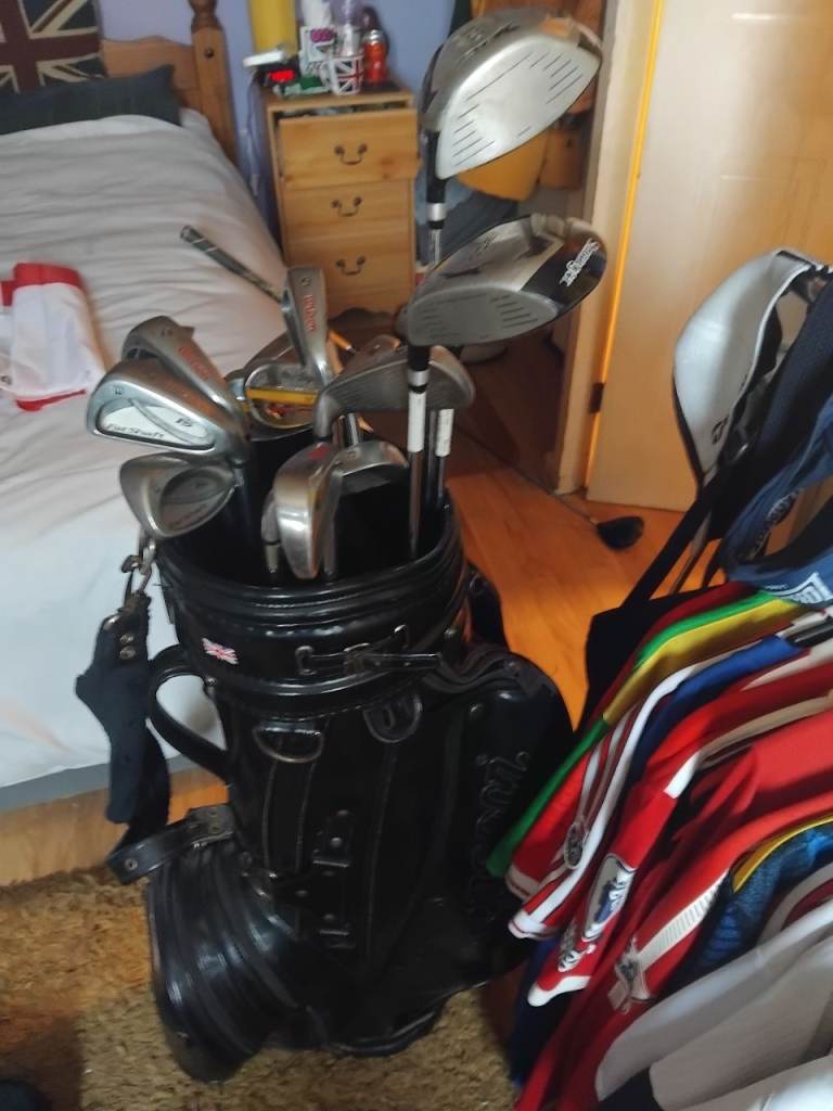 Golf cart bag.clubs and adidas shoes