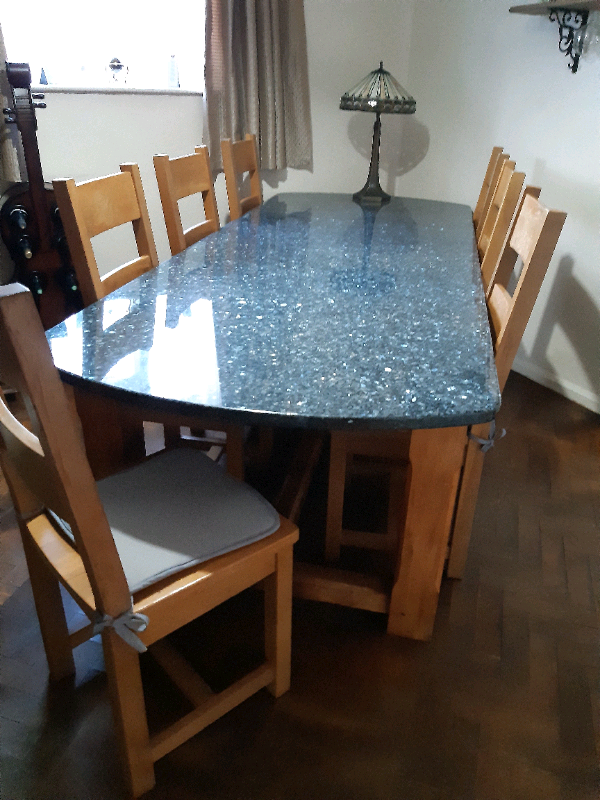  Very large Granite topped table & 8 oak chairs