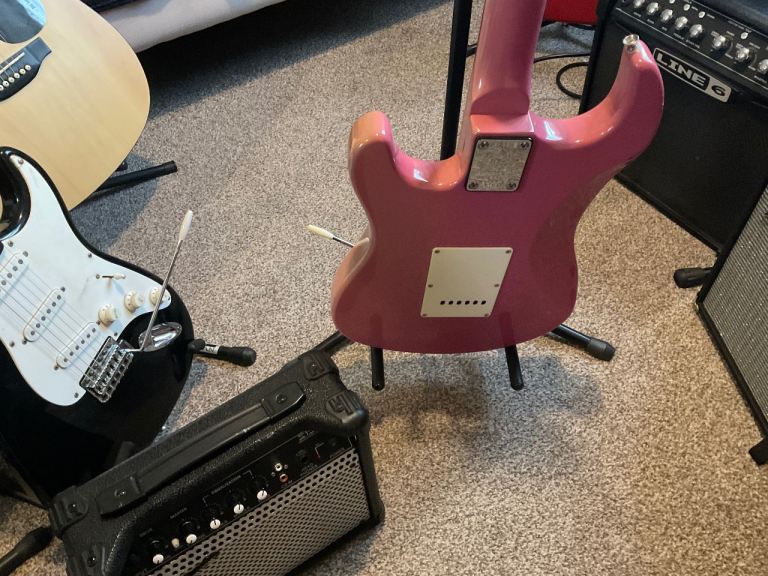 Jaxville Pink Punk electric guitar with amplifier 