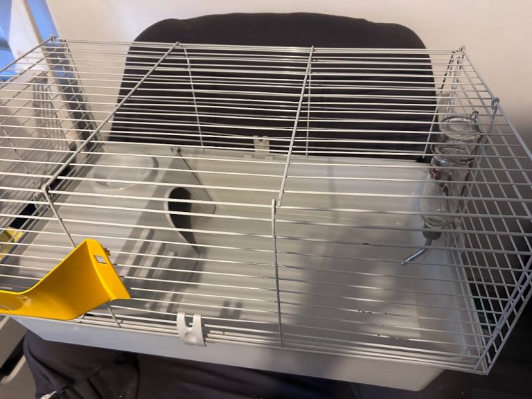 Rodent cage with food bedding water bottles….
