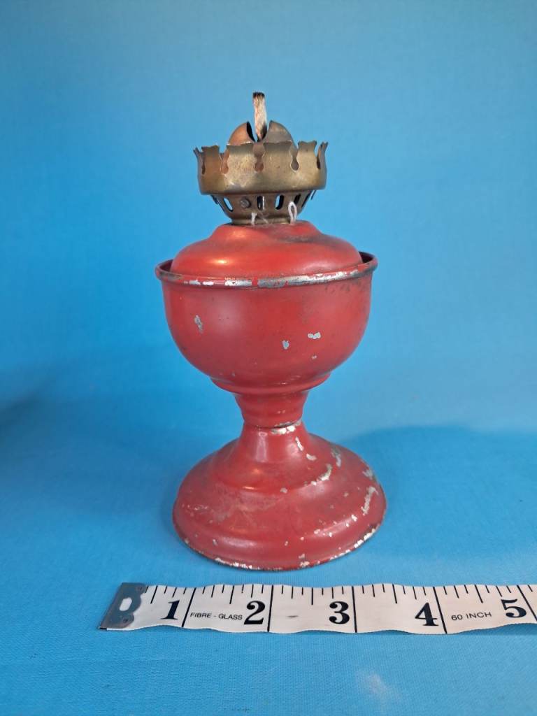 Antique red painted glass oil lamp, produced by the Pittsburgh Lamp & Glass between 1900 and 1910