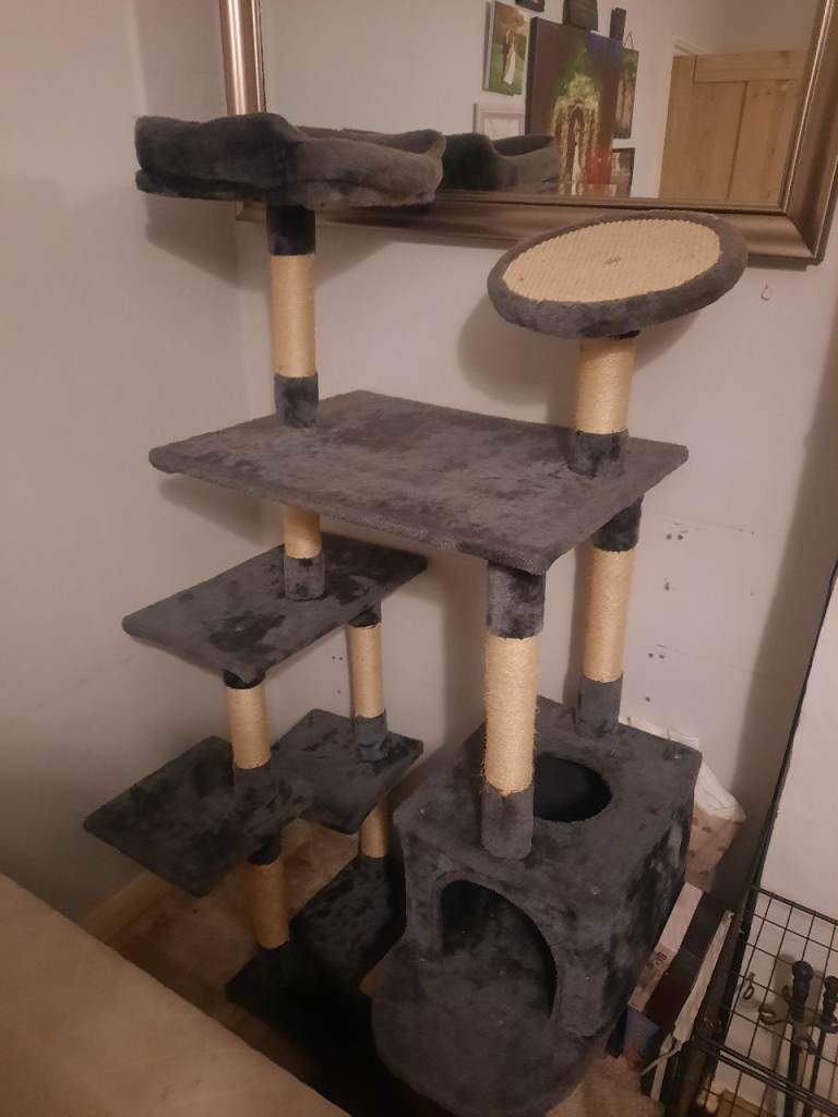 Cat activity tower with scratch posts, bed and house