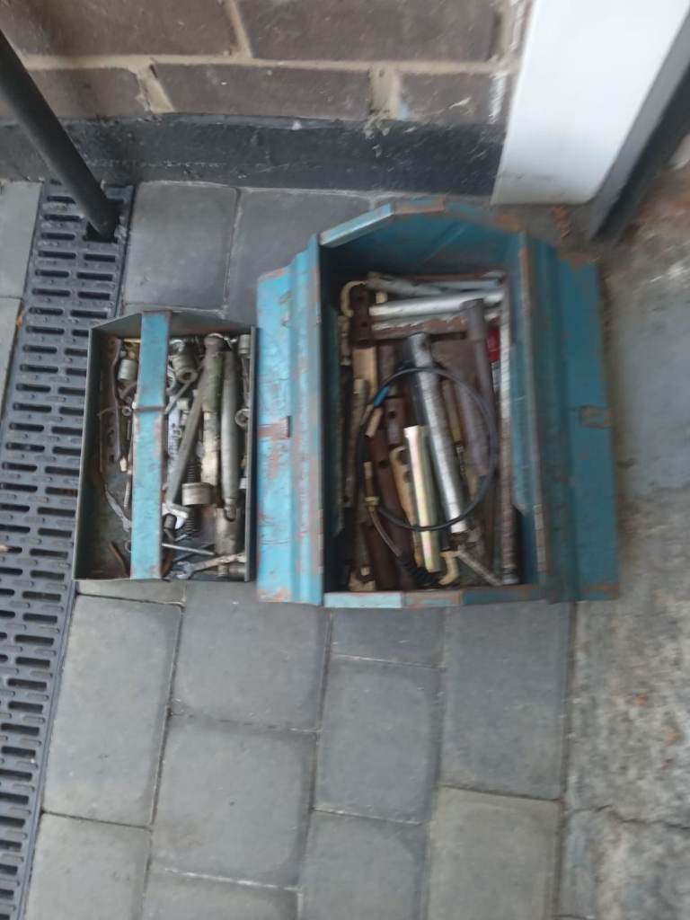 Old metal toolbox with old sockets and spanners.
