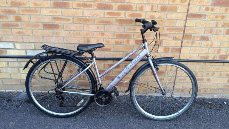 Apollo Haze Hybrid bike with mudguards, rear rack carrier and bell. The frame size is 17"