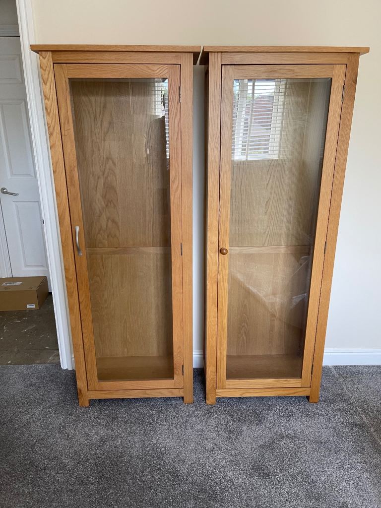 Two oak glass fronted display cabinets / bookcases 