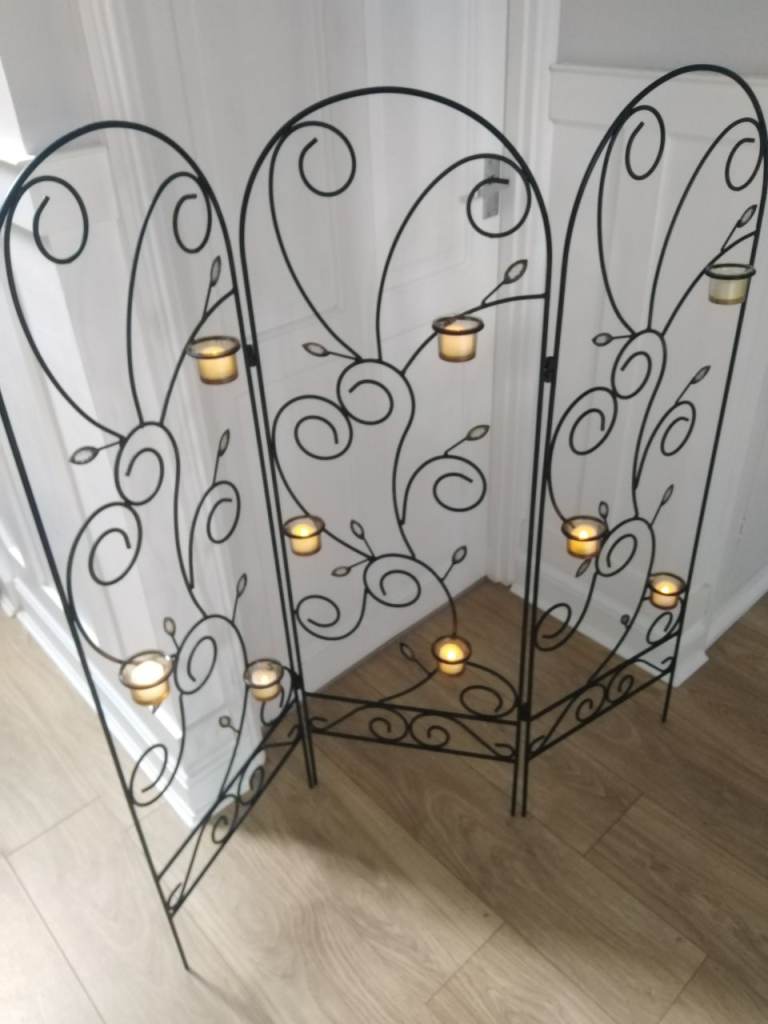Decorative metal screen with glass dishes 