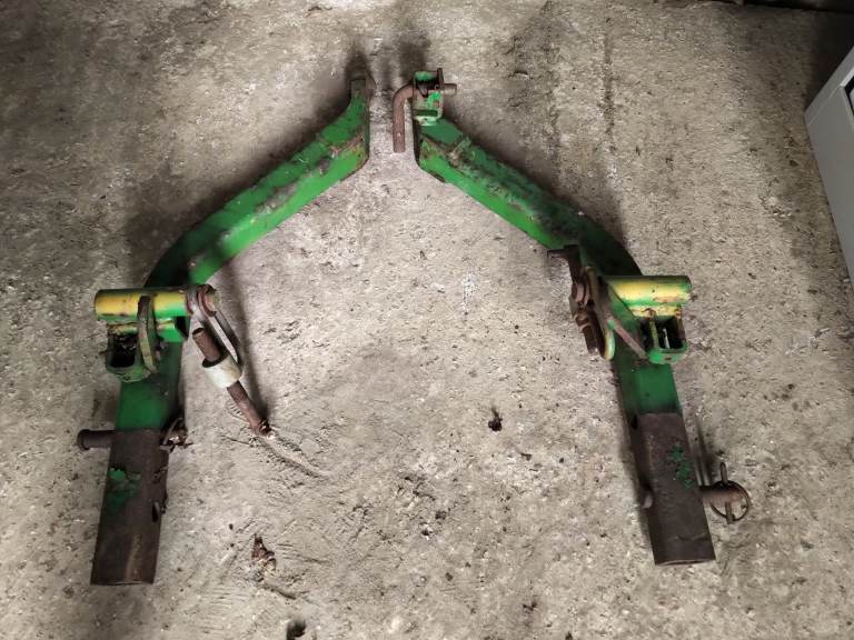 Pair of John Deere 1445 mower lift arms