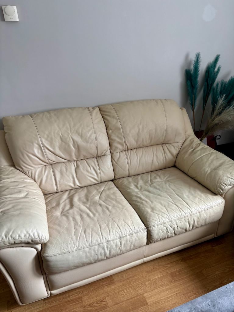 Leather sofa with footstool/storage box