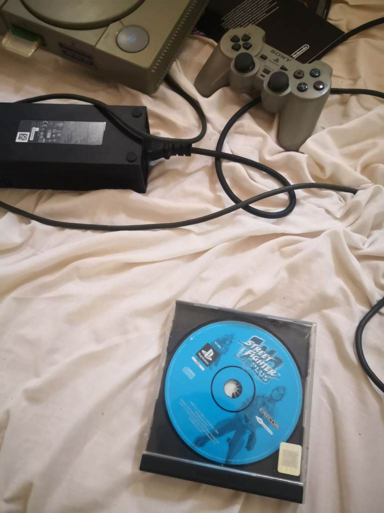 Sony PlayStation 1 Console with Controller and Street Fighter Game